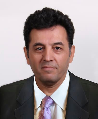 Sirous Ranjbar photographed looking towards the camera.